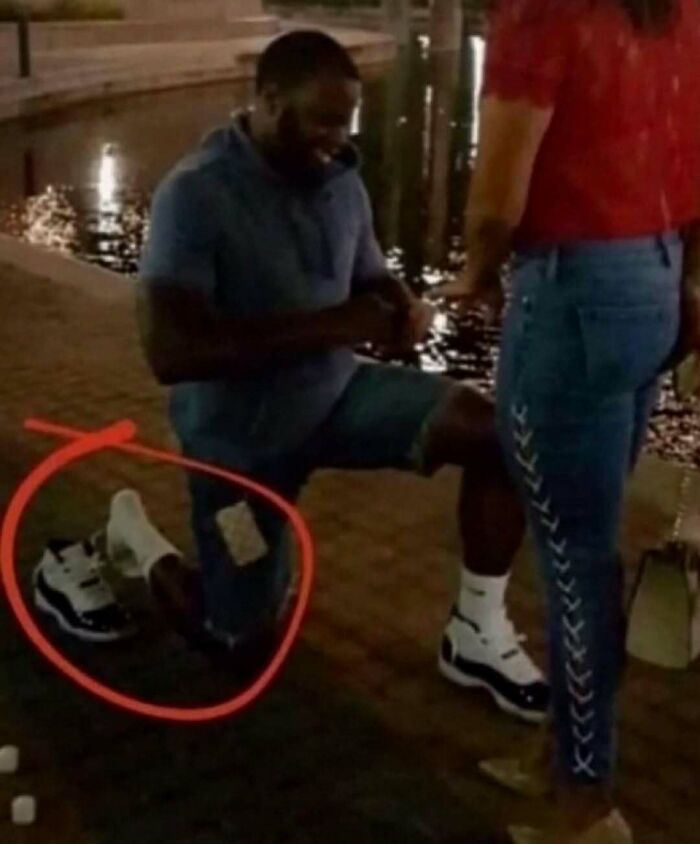 Hilarious pics of a man proposing while carefully hovering his knee to protect his sneaker.