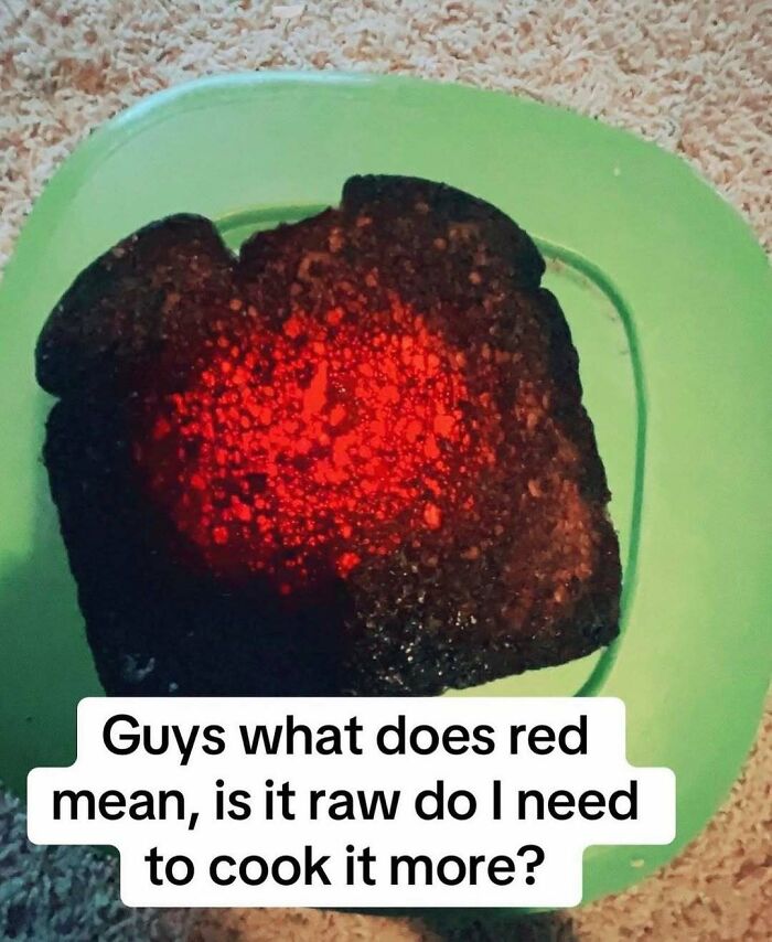 A slice of extremely burnt toast glowing red hot in the center, featured in an amusing post