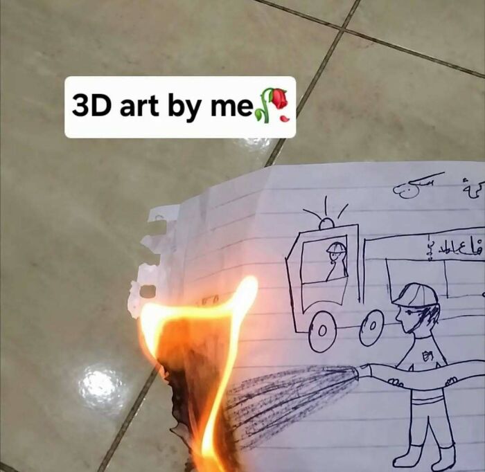 Hilarious pics showing a drawing of a firefighter holding a hose, with real flames burning the corner of the paper.