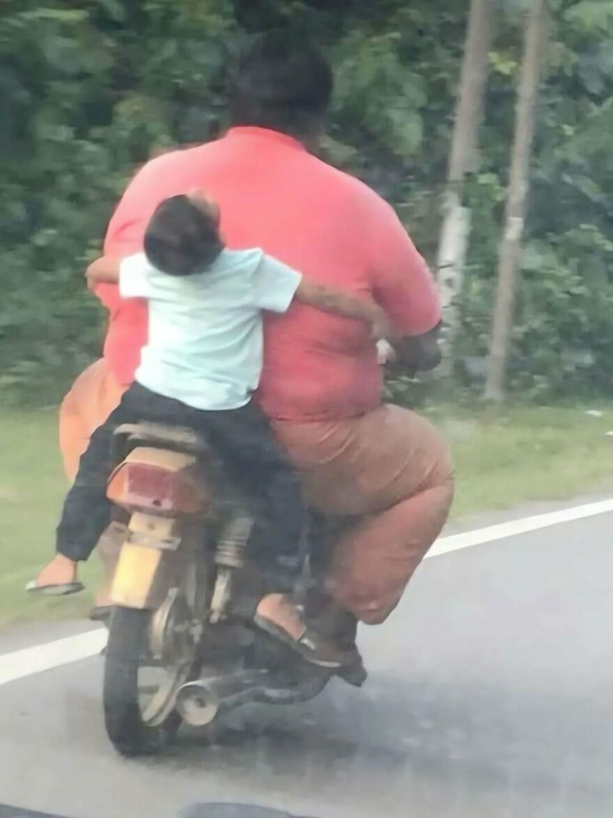Out-of-context pics of a small child hugging a adult driver from behind while riding a motorcycle down the street.