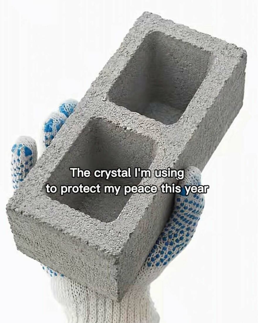 Funny memes with a cinder block labeled as a protective crystal held in a gloved hand.