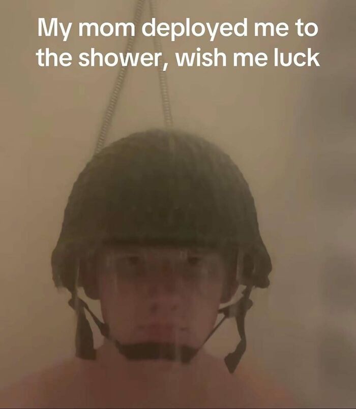Funny meme of a boy in a military helmet under a shower, highlighting relatable humor.