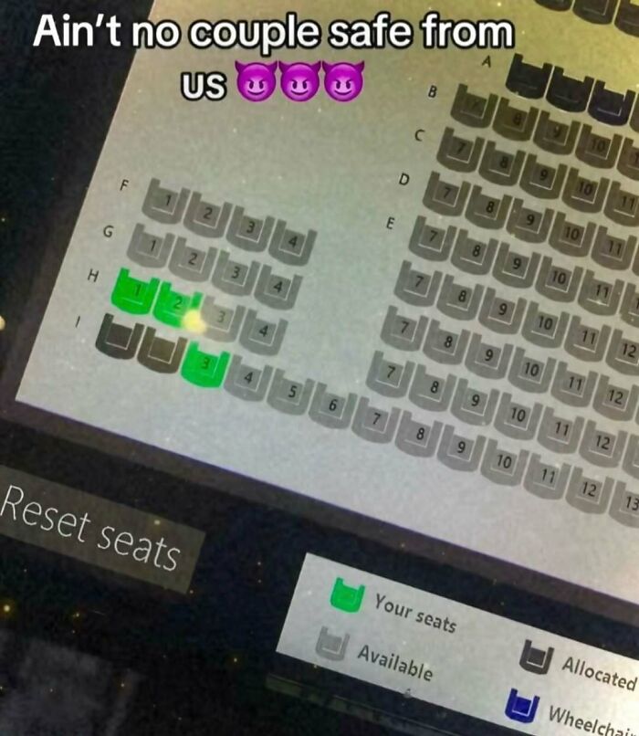Cinema seating chart showing blocked seats with caption about couples safety