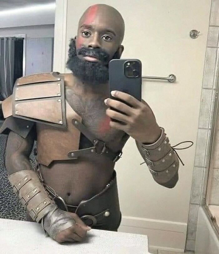 A man taking a mirror selfie while cosplaying as Kratos, one of many amusing posts