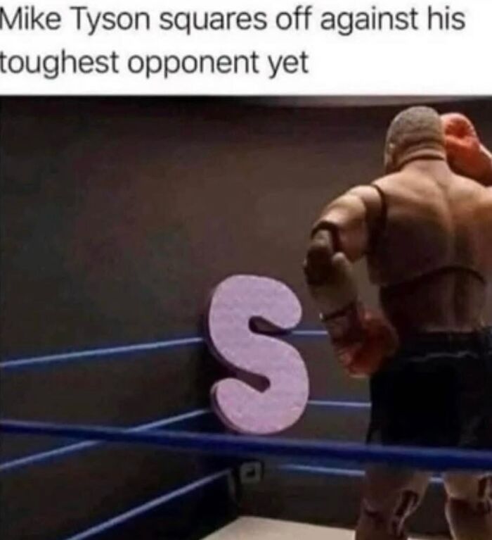 Mike Tyson action figure preparing to fight a giant letter S in a boxing ring, part of hilariously relatable memes.
