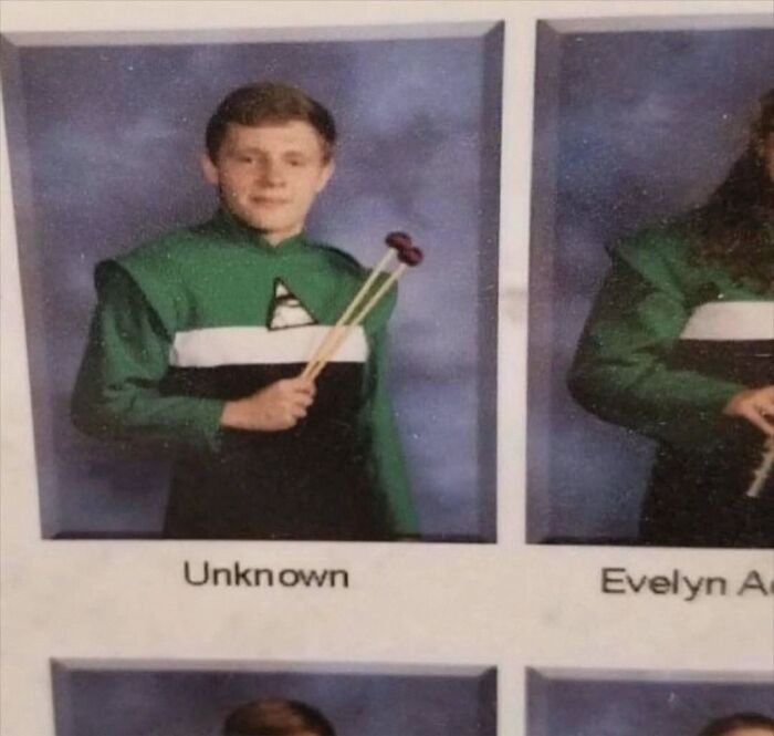 A hilarious yearbook photo showing a student labeled as Unknown holding drumsticks.