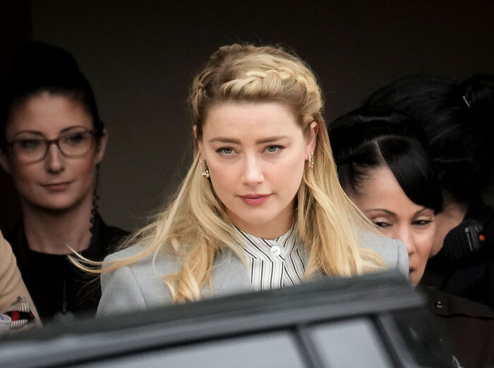 Amber Heard looking serious while leaving court during her lawsuit trial