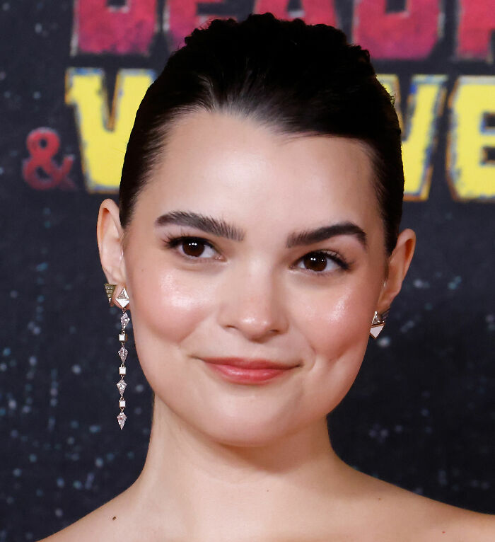 Hollywood star Brianna Hildebrand smiles at a red carpet event, showing her real-life appearance. Hollywood star Brianna Hildebrand smiles at a red carpet event, showing her real-life appearance.