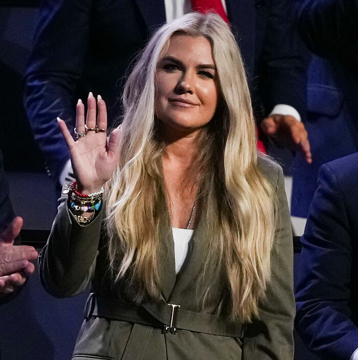 Erika Kirk wearing colorful bracelets and waving her hand in a viral photo. Erika Kirk wearing colorful bracelets and waving her hand in a viral photo.
