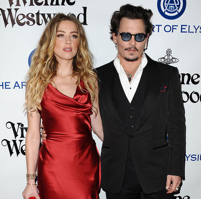 Amber Heard and Johnny Depp posing together at a red carpet event before the Amber Heard lawsuit