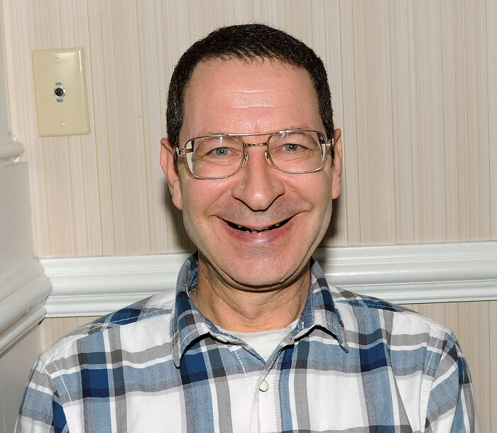 Close-up portrait of smiling actor Eddie Deezen, relevant to How Do Men Lack Self-Awareness.