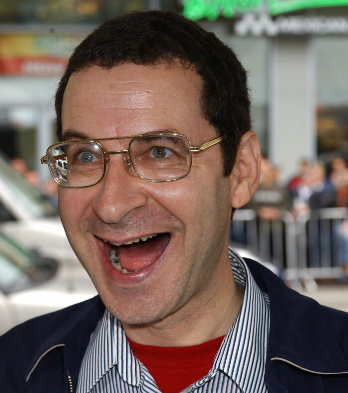 Eddie Deezen with a wide-open smile, highlighting discussions on How Do Men Lack Self-Awareness.