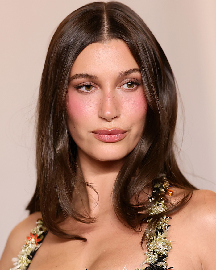 Unedited photo of Hailey Bieber attending the Academy Museum Gala with natural makeup.