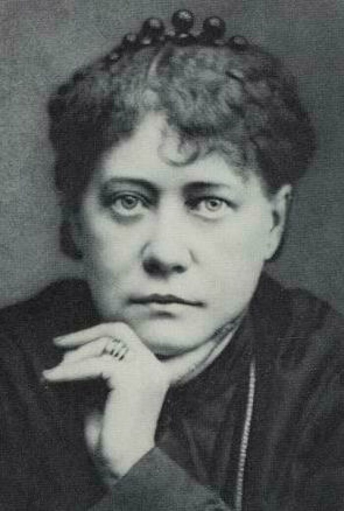 A black and white portrait of a woman, representing figures associated with lesser-known cults.