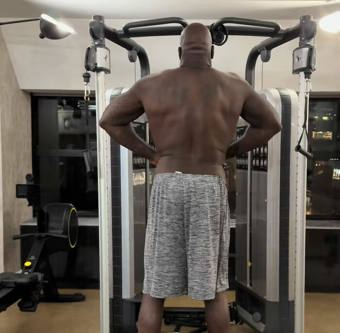 Shaquille O'Neal doing a workout at gym equipment showing his muscular back Shaquille O'Neal doing a workout at gym equipment showing his muscular back