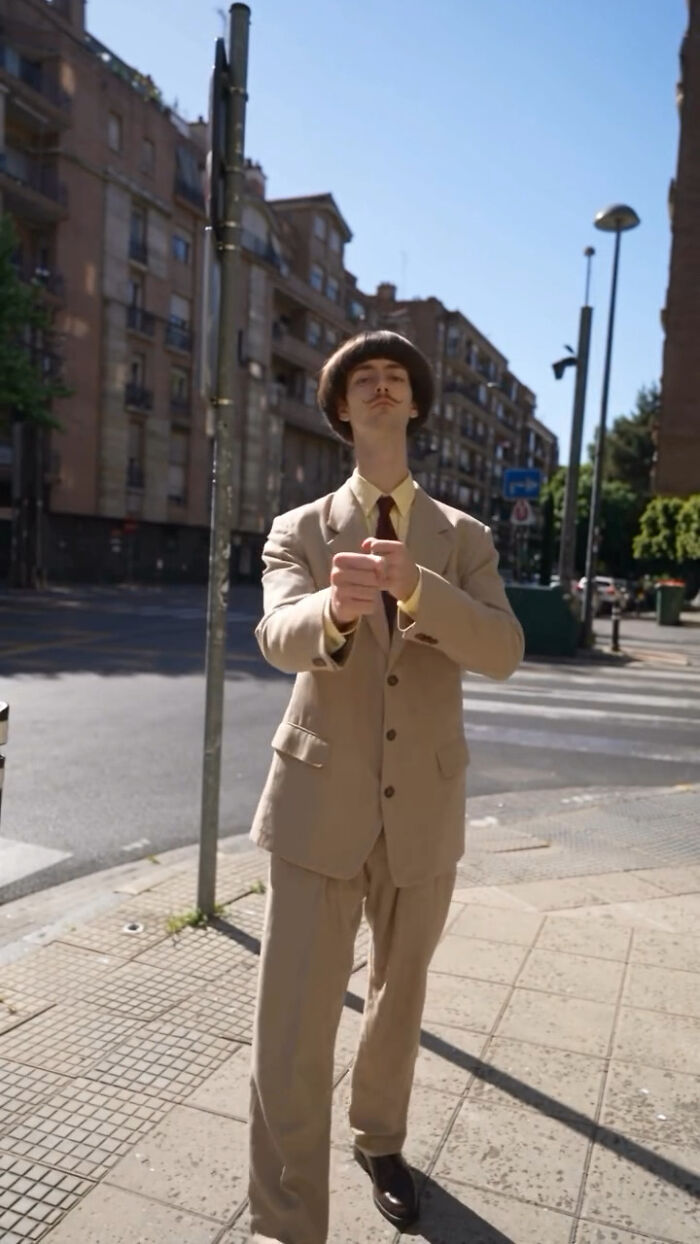 An AI-generated slim male character in a beige suit posing on a city street, raising concerns over fake faces An AI-generated slim male character in a beige suit posing on a city street, raising concerns over fake faces