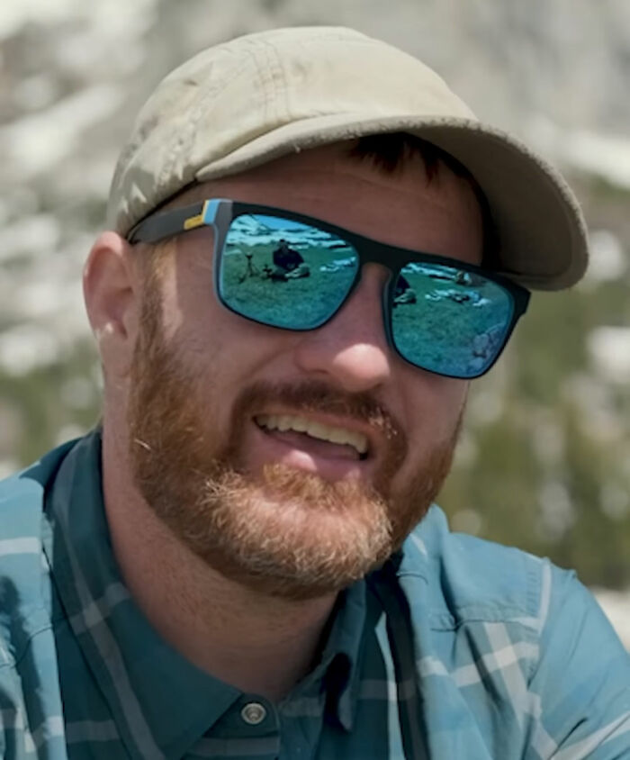 Close-up of the dad who climbed Yosemite's El Capitan wearing sunglasses and a cap