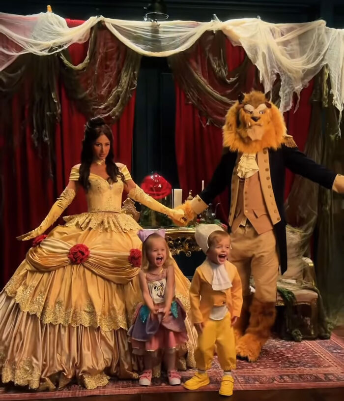 Paris Hilton family posing together in Halloween costumes for a Beauty And The Beast photoshoot.