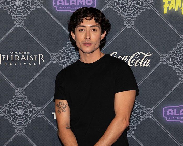 Actor Leo Sheng posing in a black t-shirt, representing trans actors in Hollywood.