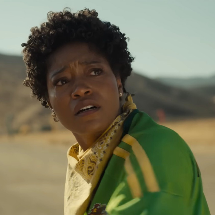 Hollywood actress Keke Palmer looking surprised in a green jacket