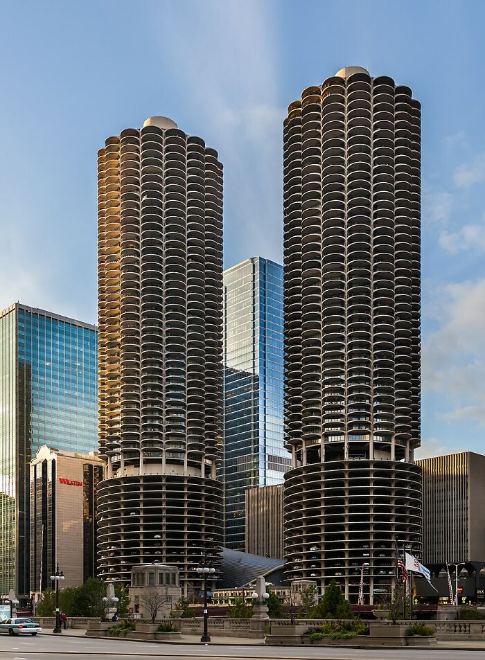 Twin cylindrical strange buildings with curved balconies in urban area