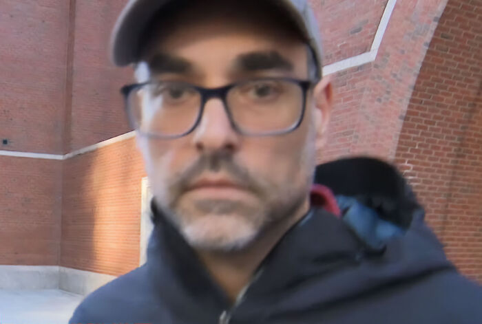 Dad wearing glasses and a cap caught red handed after committing a crime mid-flight