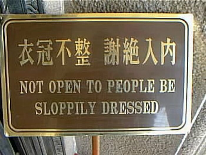 Brown sign with translation fails that reads Not Open To People Be Sloppily Dressed