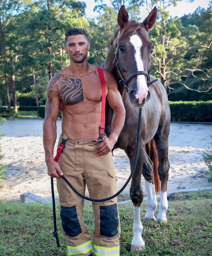 Tattooed Australian firefighter standing shirtless with horse in 2027 firefighters calendar