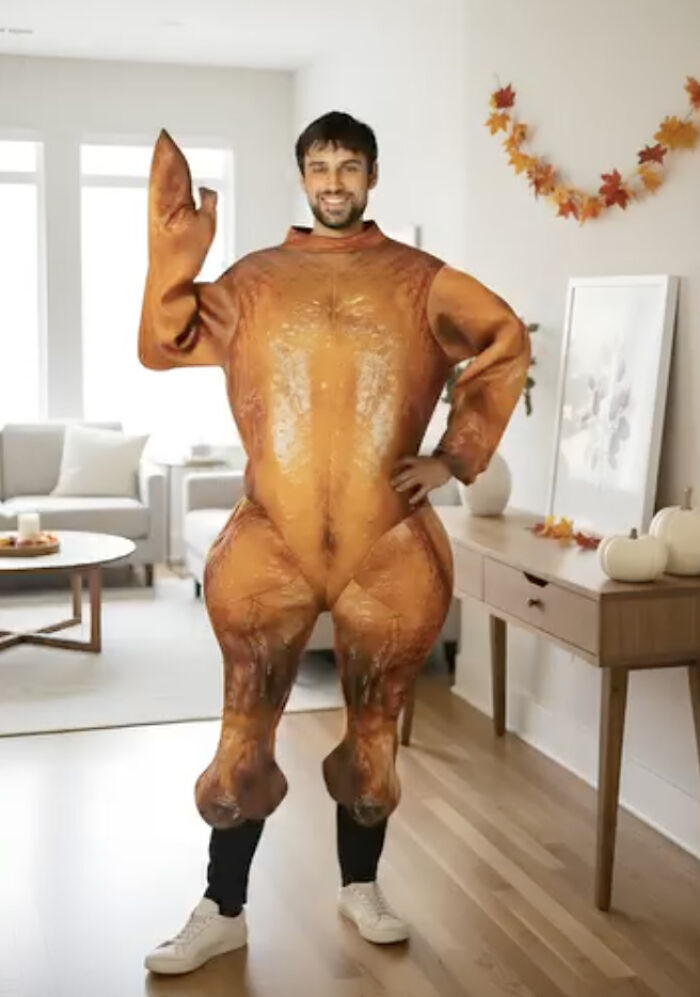 A man wearing a funny inflatable turkey costume posing as a low-effort Halloween costume idea.