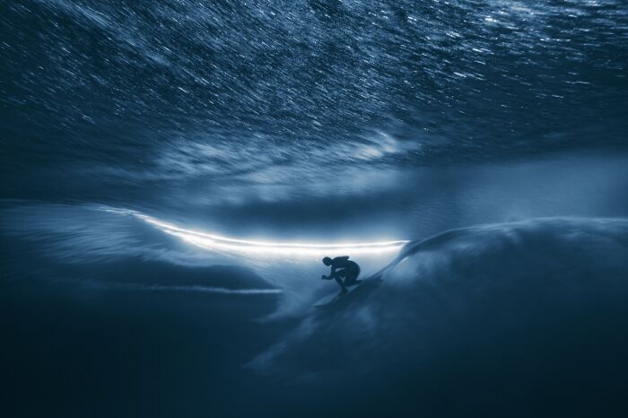 Underwater surreal shot of surfer inside wave at Siena International Photo Awards