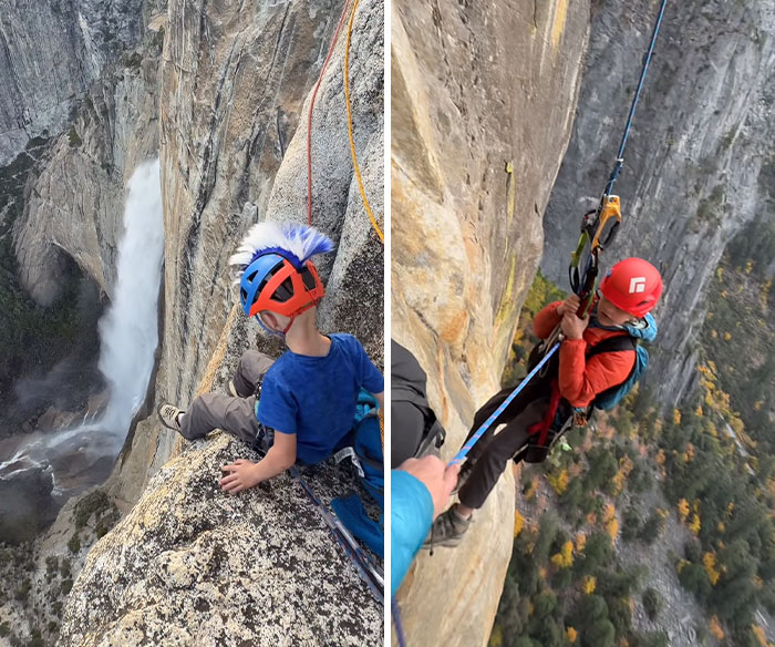 A young boy wearing a climbing helmet looks down a steep cliff near Yosemite's El Capitan