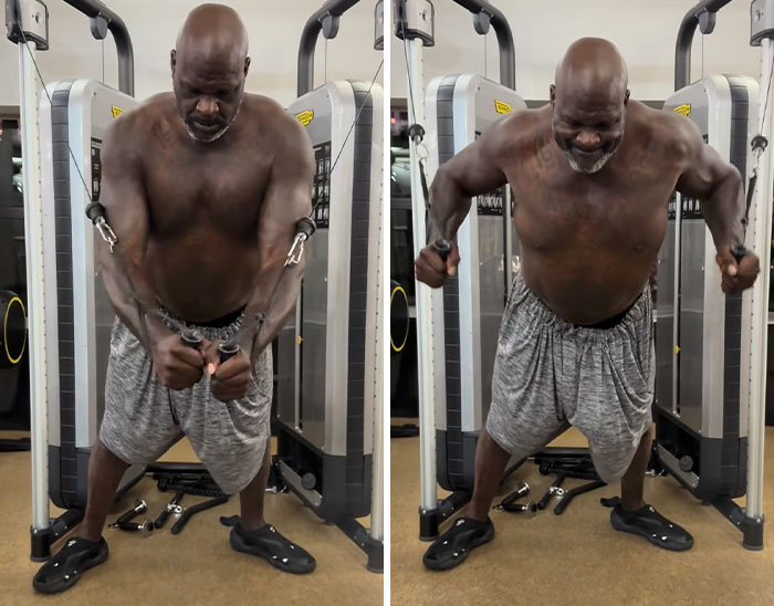 Shaquille O'Neal shirtless doing cable fly exercises at gym Shaquille O'Neal shirtless doing cable fly exercises at gym