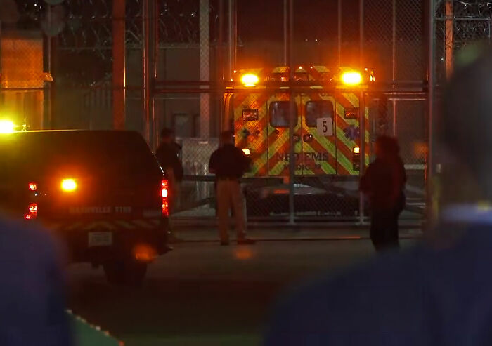 Emergency vehicles with lights on outside a facility, related to Christa Pike botched lethal injection