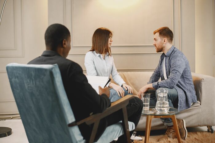 A couple during a counseling session talking about their personal secrets