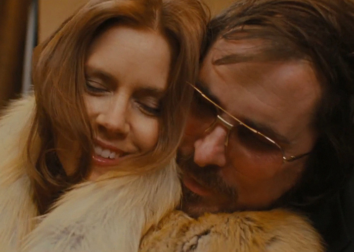 Hollywood star Amy Adams smiling with a co-star in a film amidst fan debate about her career slump.