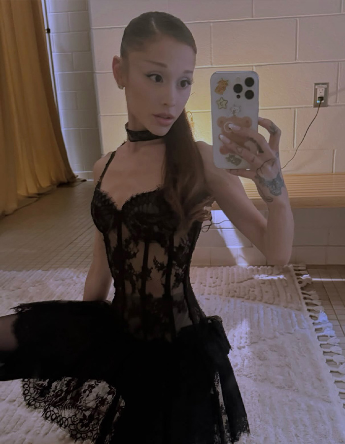 Ariana Grande taking a selfie showing a new look away from her signature ponytail style.