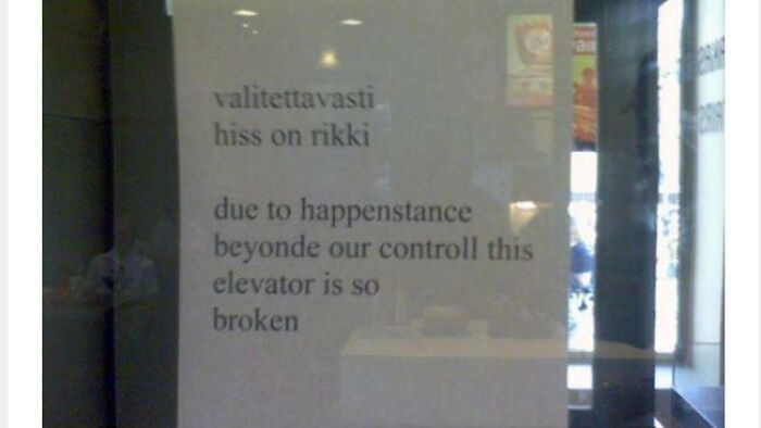 Sign with translation fails stating due to happenstance beyond control this elevator is so broken