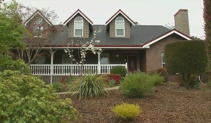 An exterior view of a suburban house related to the investigation after placing a spy camera at work. An exterior view of a suburban house related to the investigation after placing a spy camera at work.
