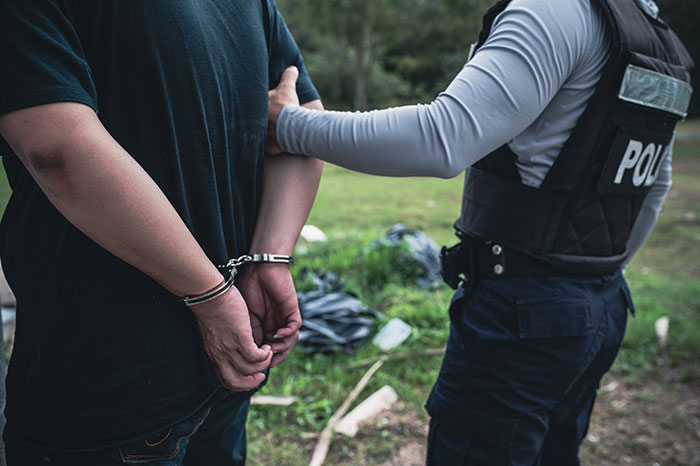 A police officer arrests a man, representing the dramatic climax when a bestie tries to make his move A police officer arrests a man, representing the dramatic climax when a bestie tries to make his move