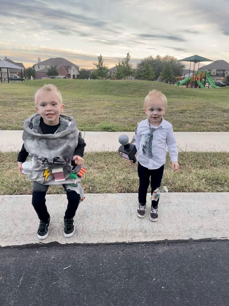 Two young kids dressed in clever DIY Halloween costumes representing a tornado and a storm reporter outdoors.