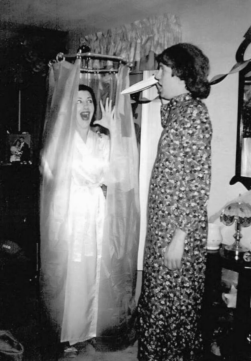 Two people dressed in a classic vintage Psycho shower scene Halloween costume.