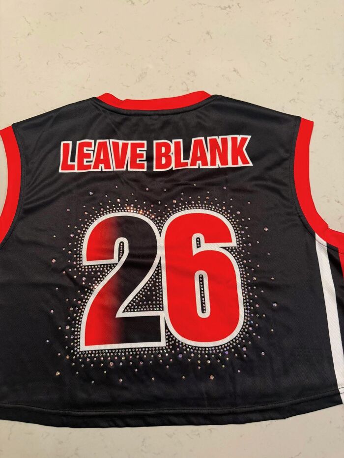 A customized sports jersey printed literally with the text LEAVE BLANK above number 26.