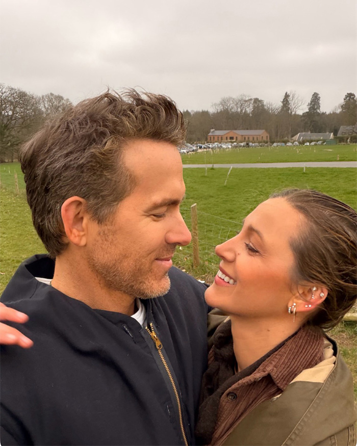 Blake Lively and Ryan Reynolds smiling closely outdoors amid leaked celebrity texts news. Blake Lively and Ryan Reynolds smiling closely outdoors amid leaked celebrity texts news.