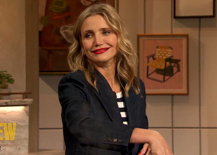 Actress Cameron Diaz smiling during a TV interview while facing scrutiny over her looks and aging.