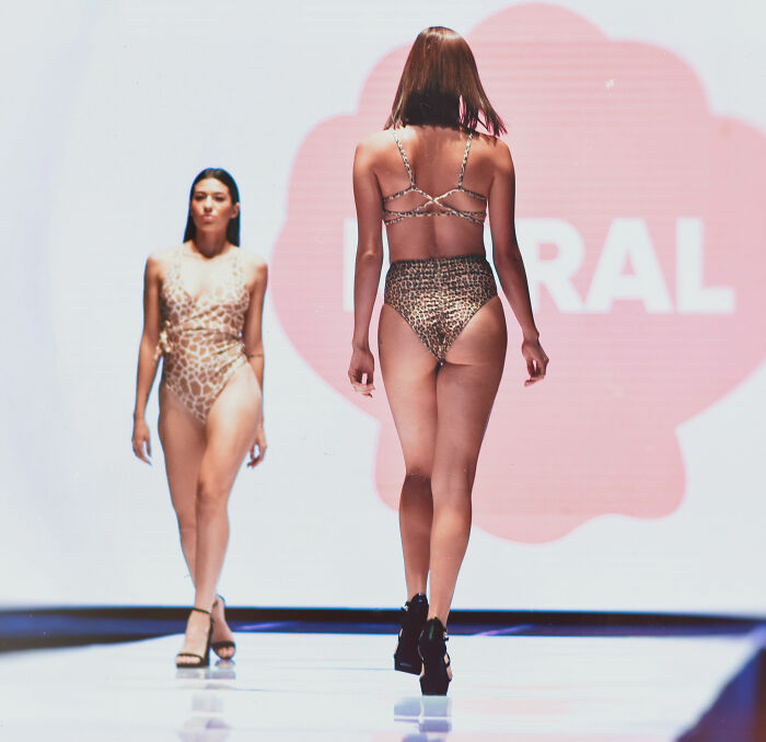 Models walking on a runway in swimwear, exposing hygiene breaches happening behind the scenes in fashion