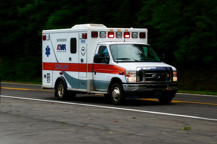 An ambulance driving fast on the road representing emergency tips during critical moments