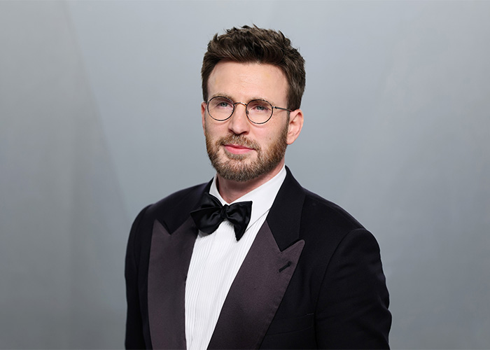 Actor Chris Evans wearing glasses and a tuxedo with bow tie Actor Chris Evans wearing glasses and a tuxedo with bow tie