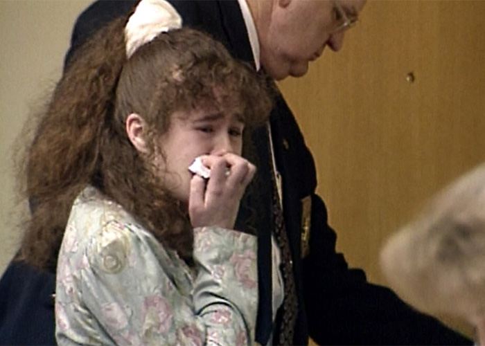 Young Christa Pike crying with a tissue during her trial for lethal injection case
