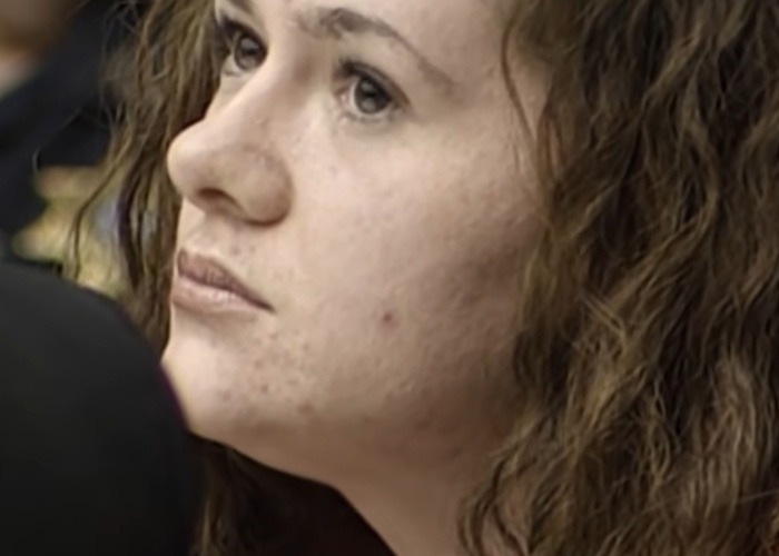 A close-up photograph of Christa Pike looking sideways