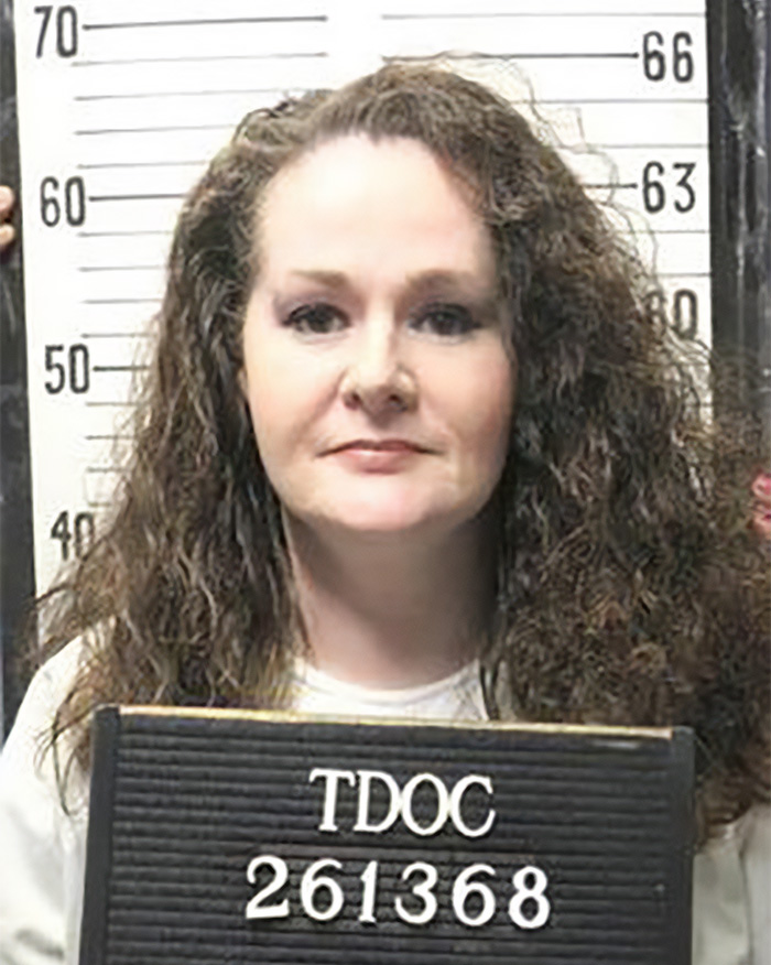 Official mugshot of Christa Pike holding a TDOC identification sign.
